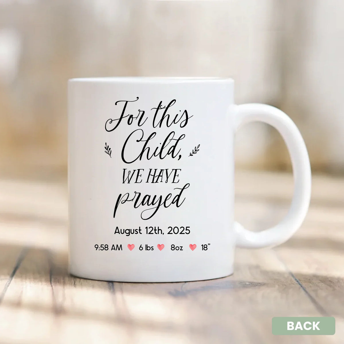 Close-up of custom baby name and birth date on a faith-based newborn mug