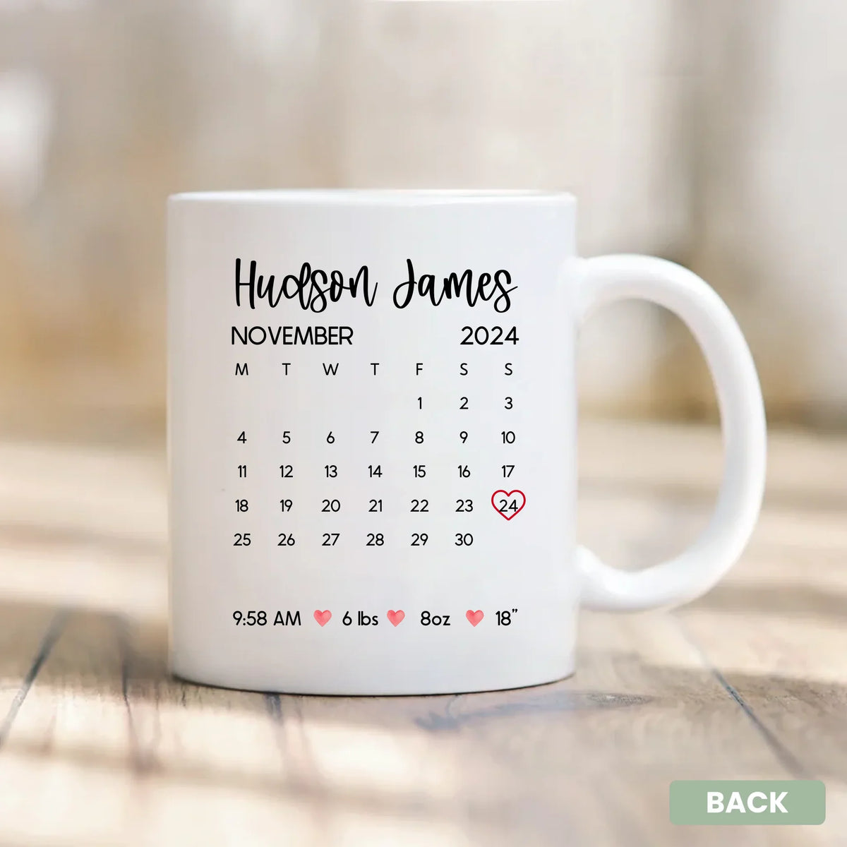 Newborn Milestone Calendar custom name coffee mug, angled view - gift for new parents