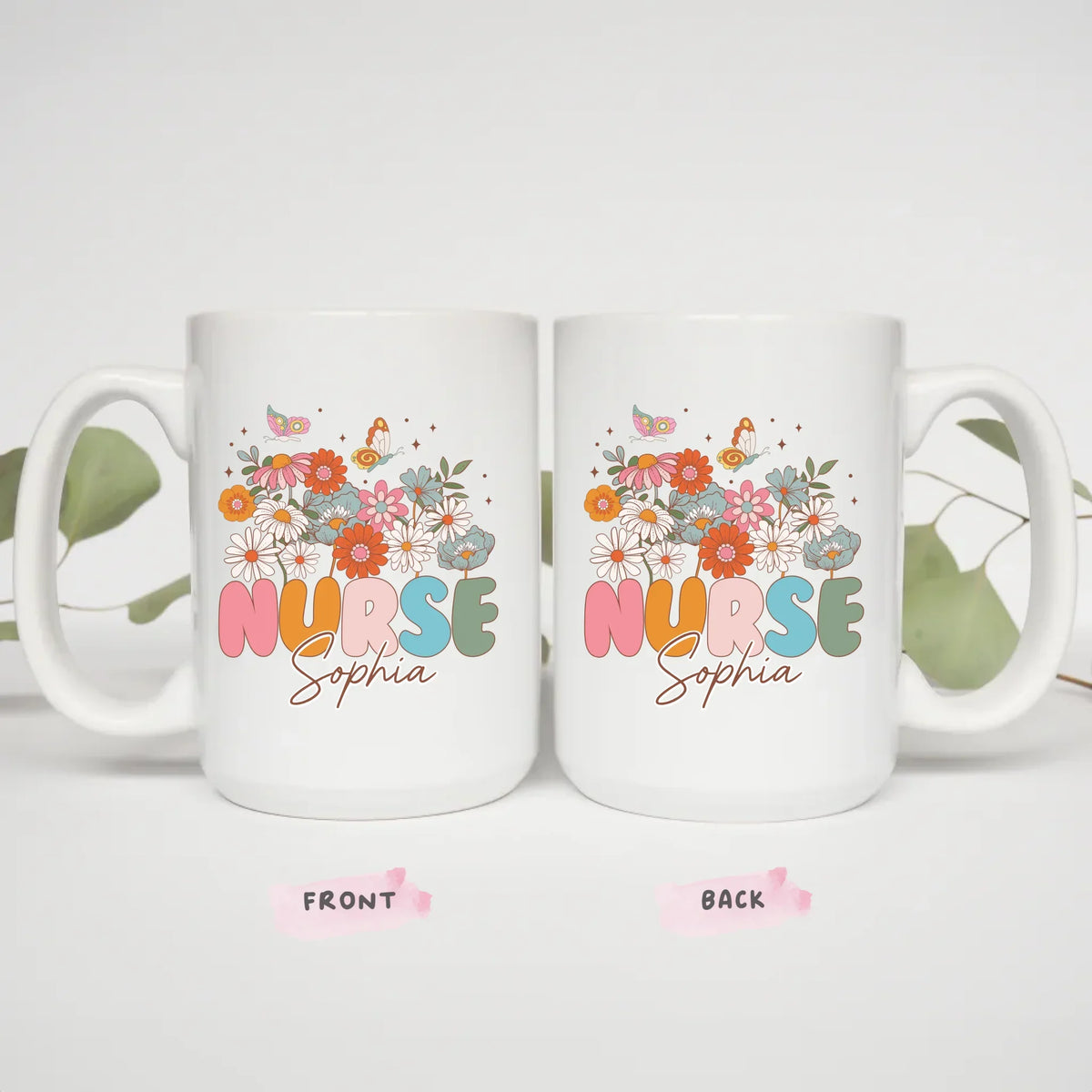 Two 15oz Everyday Hero nurse mugs styled with eucalyptus, gift idea