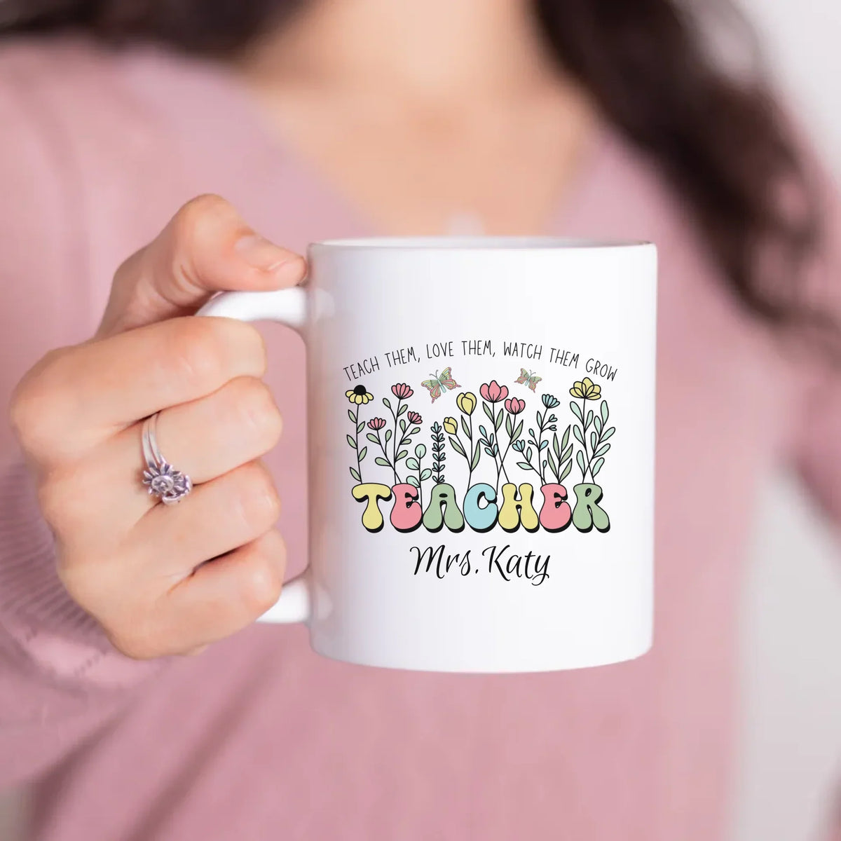 Teacher holding her personalized Flourish & Teach mug, custom name gift